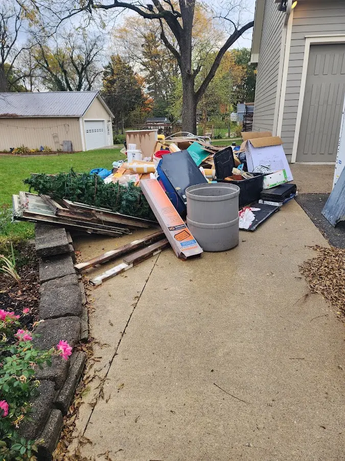Dumpster being loaded with debris for Demolition Dumpster Rental in Clarence